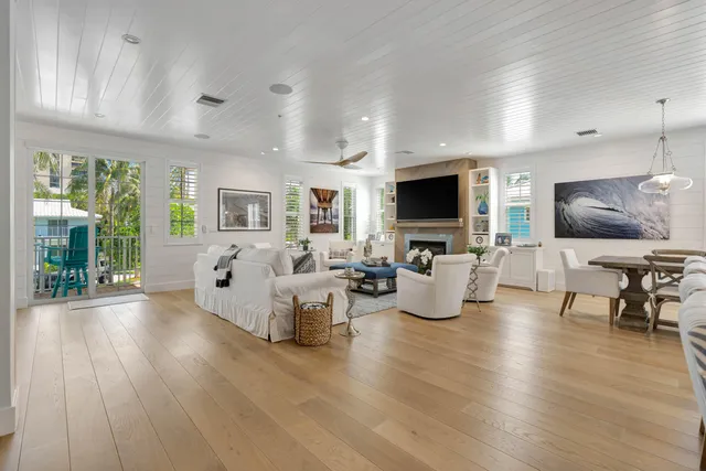 a bedroom with a large bed and a large window