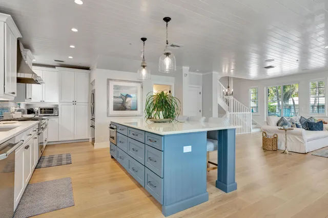 a bathroom with a granite countertop shower a sink and a mirror