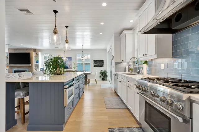 a spacious bedroom with a bed and a flat screen tv