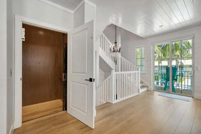 a view of a house with swimming pool and a sitting area