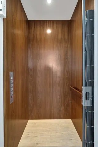 a view of a city with flower plants in front of it