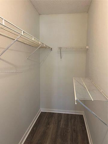 488 Fanshaw L, Unit 488 Boca Raton, FL 33434 - Photo 7 of 10 a view of small space with racks on the wall