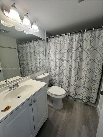 488 Fanshaw L, Unit 488 Boca Raton, FL 33434 - Photo 9 of 10 a bathroom with a sink a toilet and shower