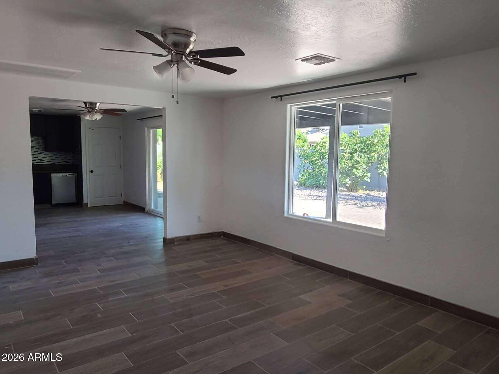 3702 East Thunderbird Road Phoenix, AZ 85032 - Photo 7 of 23 a view of an empty room with a window
