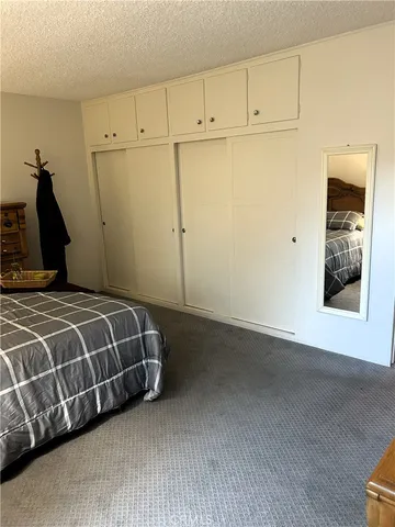 a room with a washing machine and cabinets