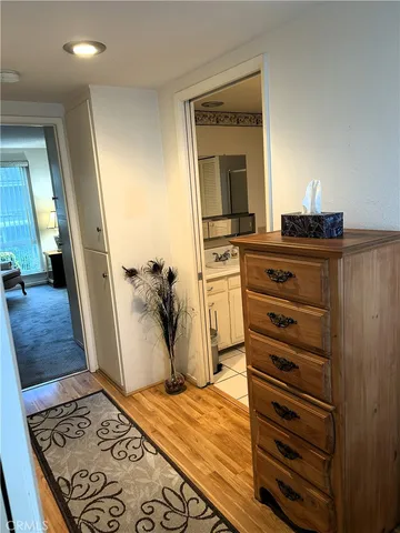 a hallway with a white stove top oven