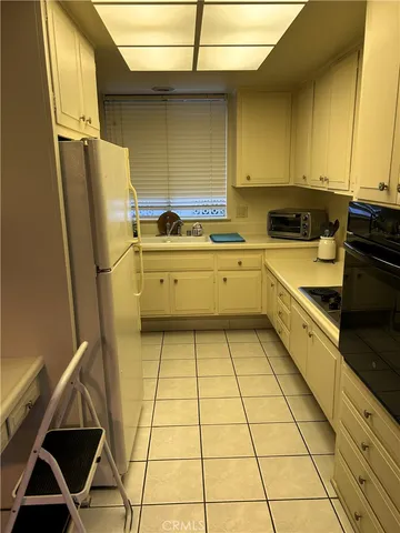 a bedroom with a bed and dresser