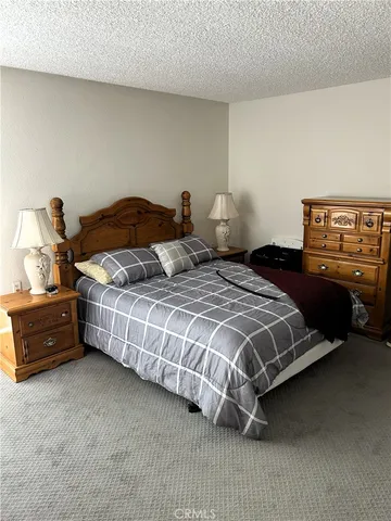 a bedroom with bed and window