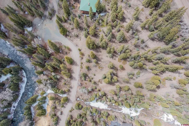 a view of residential houses with trees