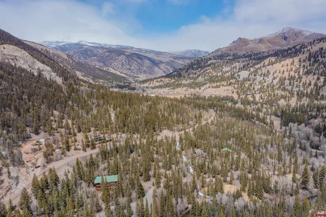 a view of a backyard of a house