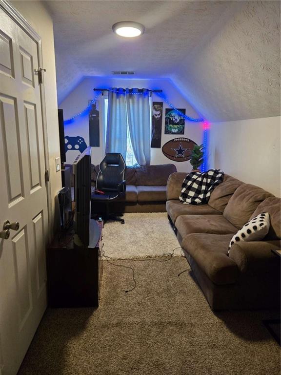 125 Sampson Court Covington, GA 30016 - Photo 11 of 13 a living room with furniture and a fireplace