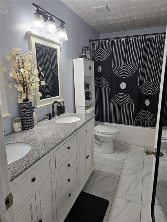 125 Sampson Court Covington, GA 30016 - Photo 12 of 13 a bathroom with a granite countertop sink and mirror