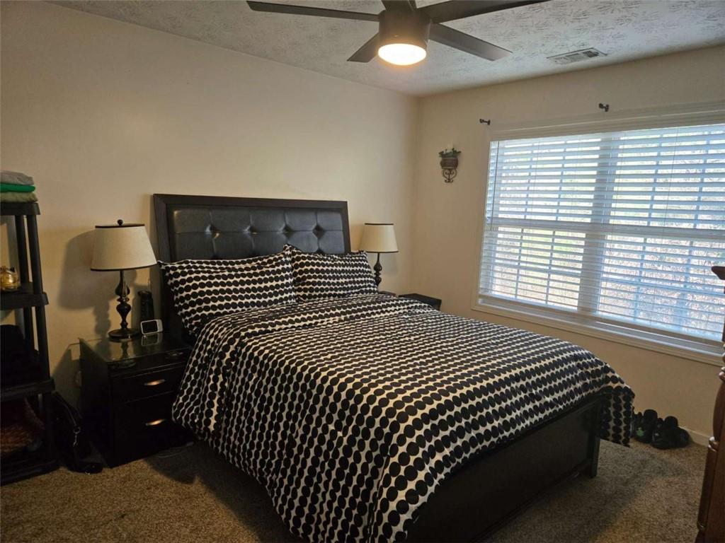 125 Sampson Court Covington, GA 30016 - Photo 7 of 13 a bedroom with bed and window