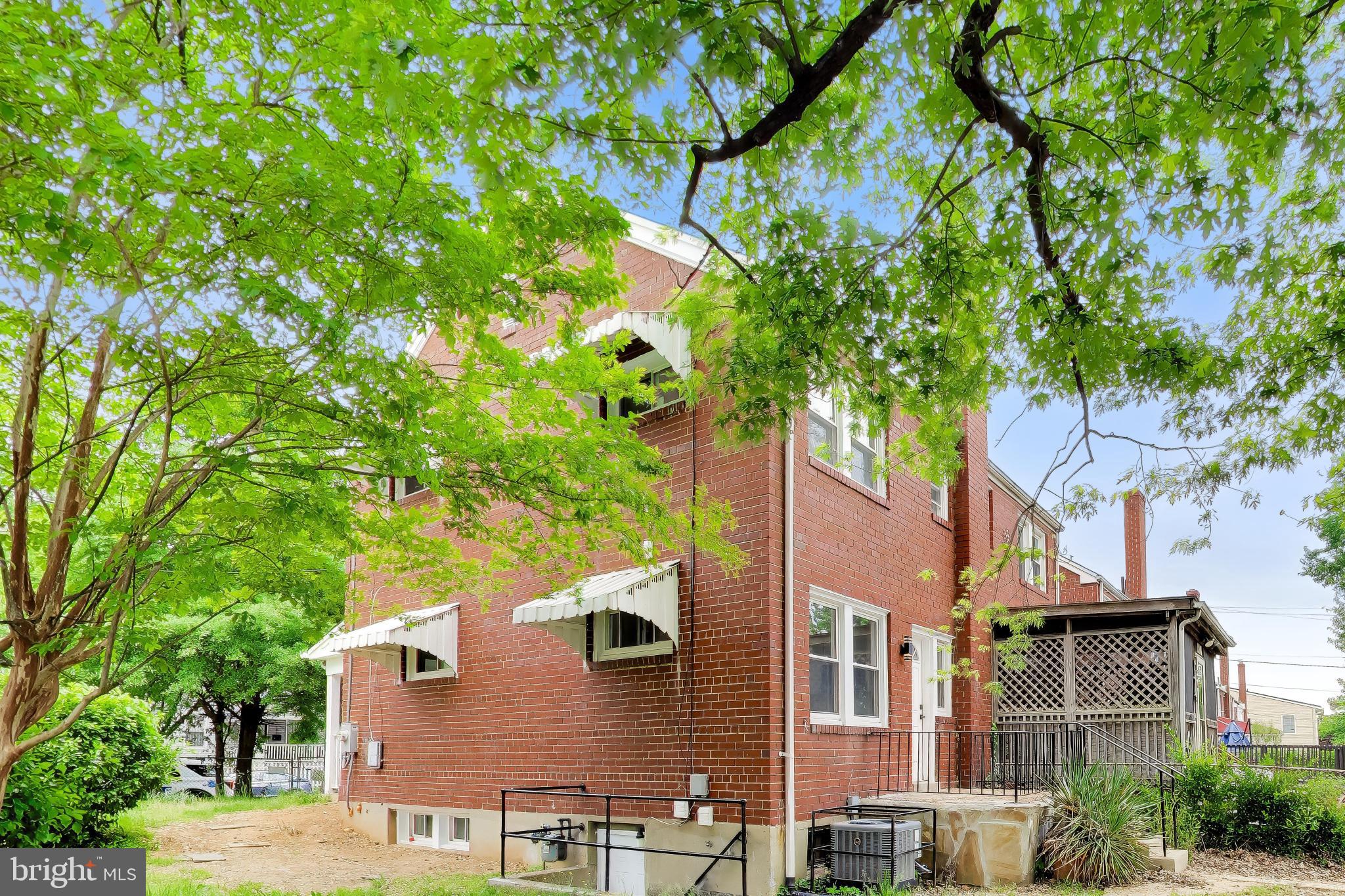 186 Forrester Street Southwest Washington, DC 20032 - Photo 26 of 32 a view of multiple house with a tree in front