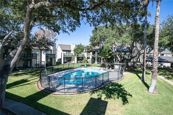 a view of a garden with a patio