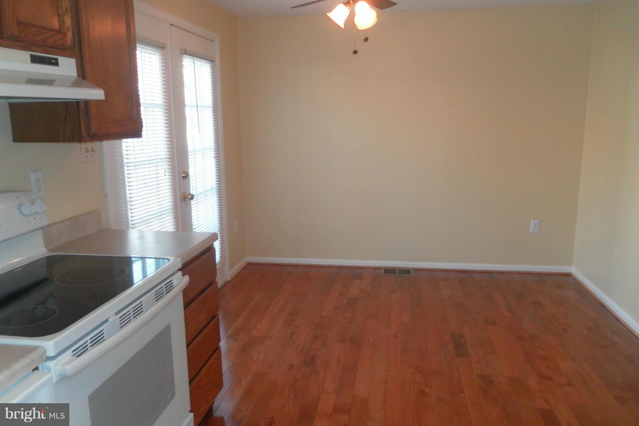 108 East Glebe Road Alexandria, VA 22305 - Photo 6 of 14 a view of a kitchen with a sink cabinets and a window