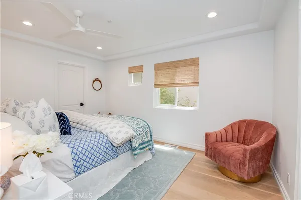a bedroom with a large bed and a couch