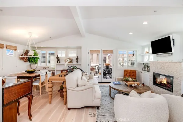 a living room with fireplace furniture and a flat screen tv