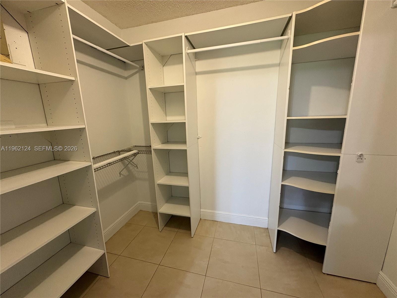 Boca del Mar Boca Raton, FL 33433 - Photo 16 of 41 a view of walk in closet with empty racks
