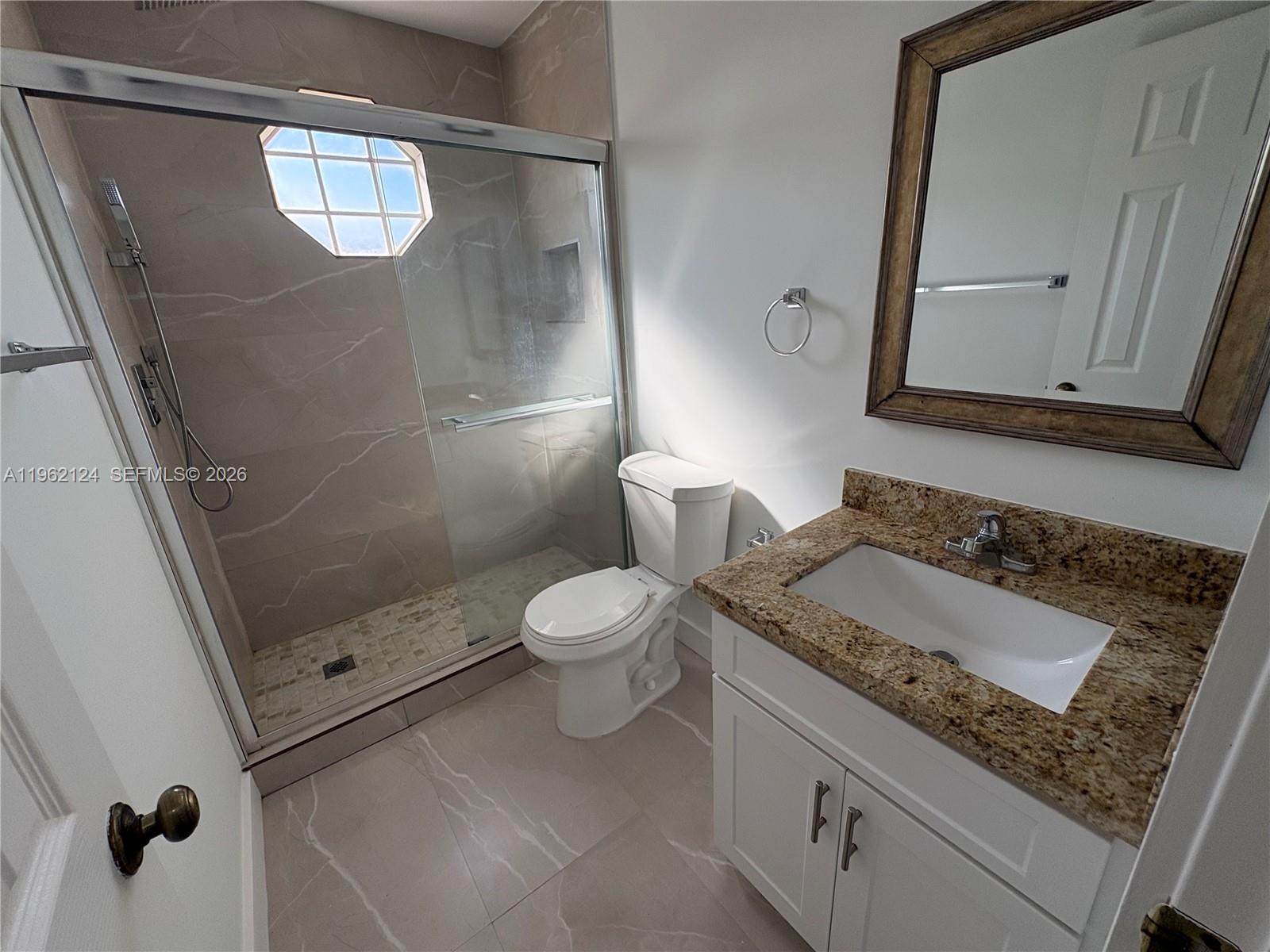 Boca del Mar Boca Raton, FL 33433 - Photo 28 of 41 a bathroom with a granite countertop sink toilet and shower