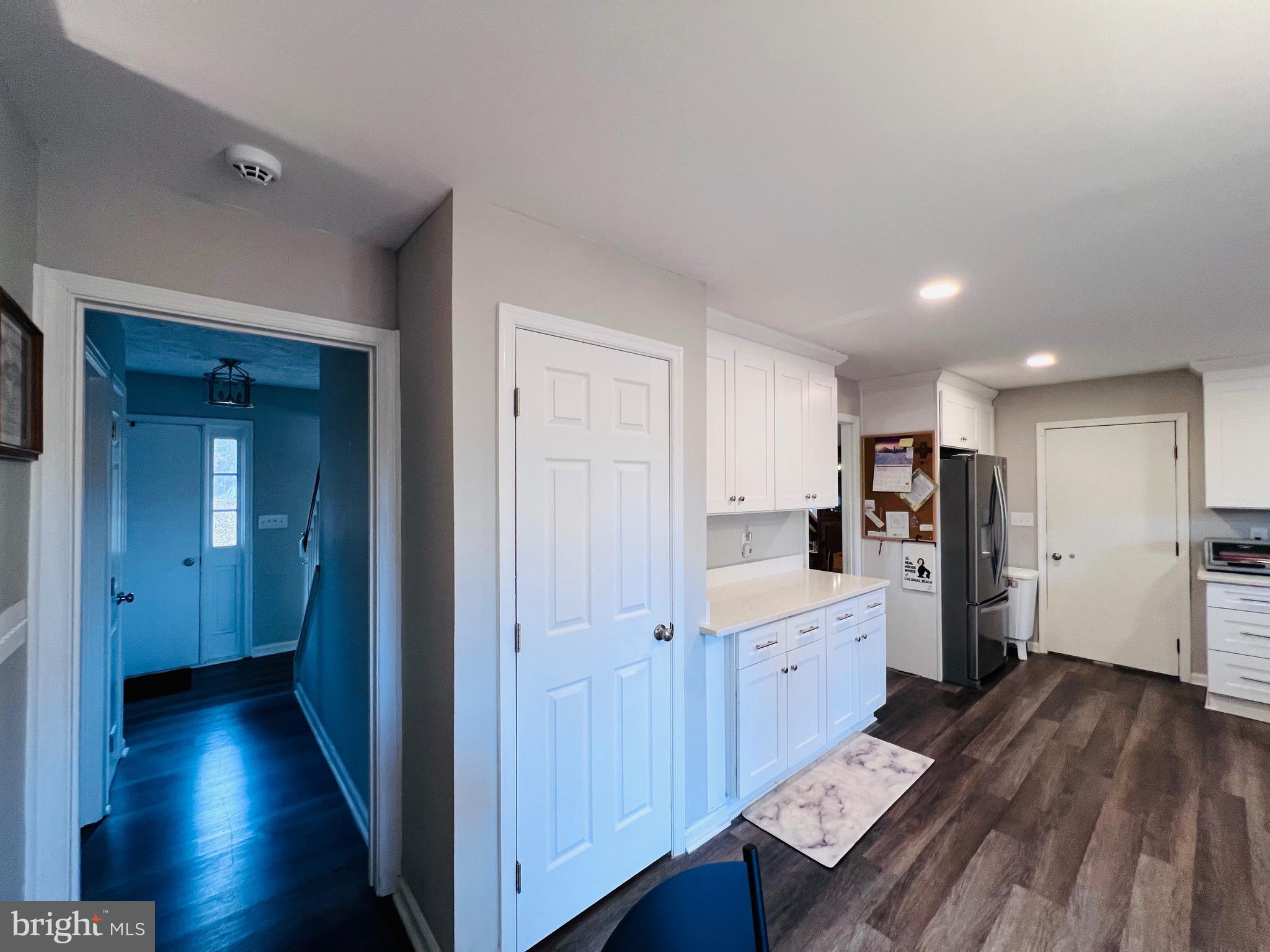 436 Thompson Circle Colonial Beach, VA 22443 - Photo 16 of 40 a view of a kitchen with refrigerator and wooden floor