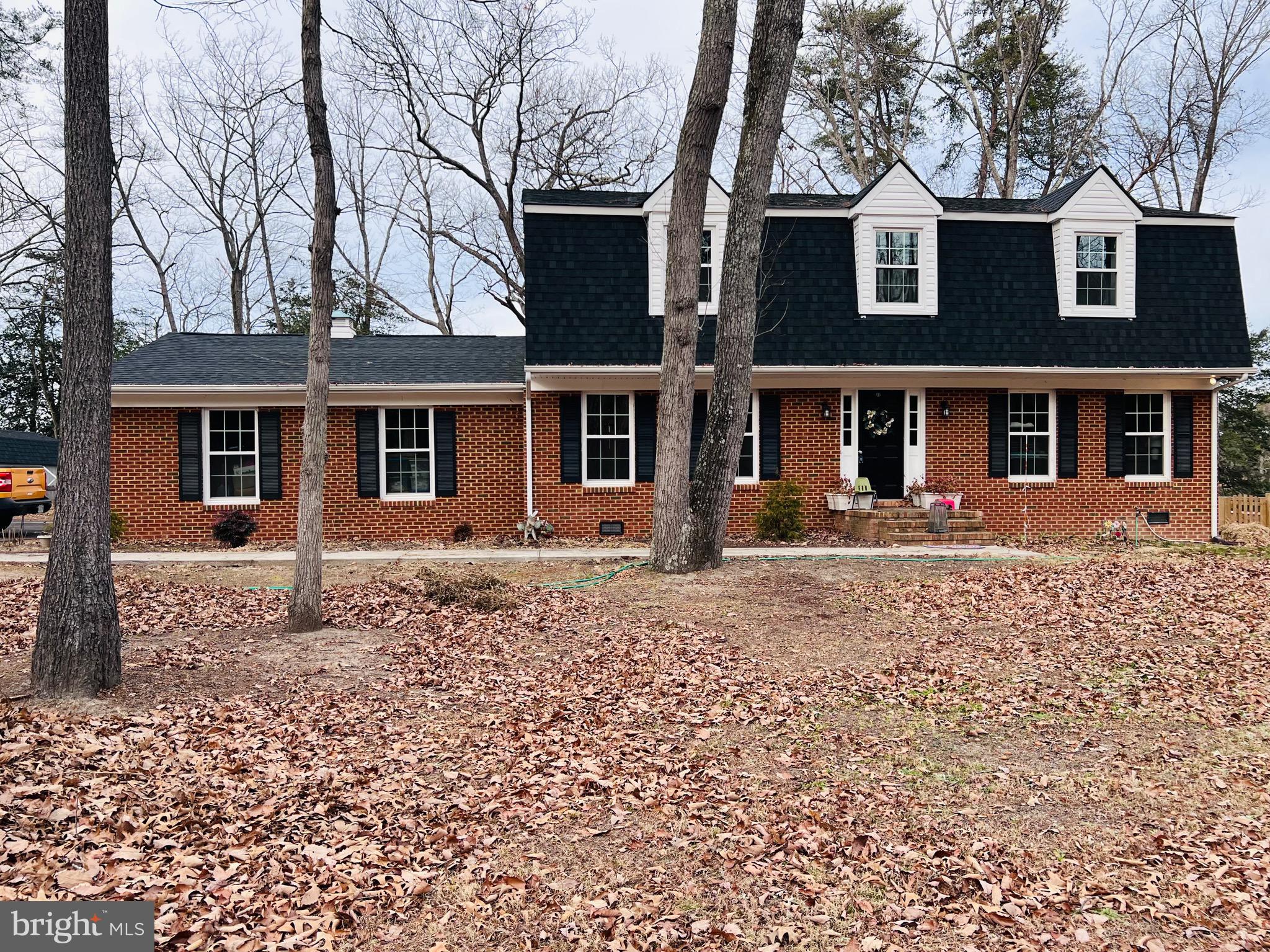 436 Thompson Circle Colonial Beach, VA 22443 - Photo 2 of 40 front view of a house with a trees