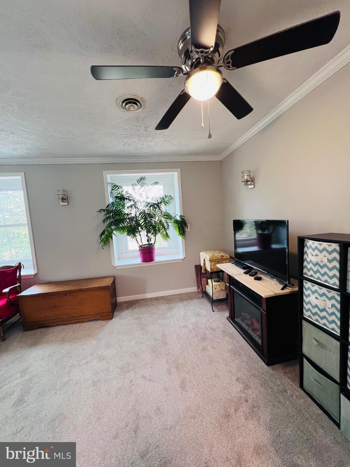 436 Thompson Circle Colonial Beach, VA 22443 - Photo 21 of 40 a living room with furniture and a ceiling fan