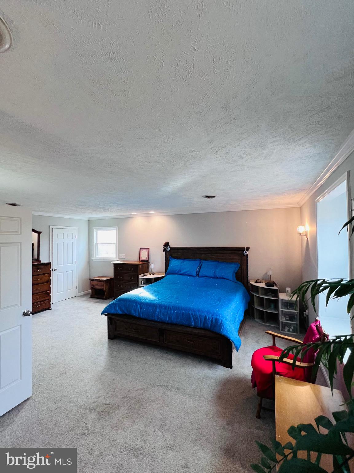 436 Thompson Circle Colonial Beach, VA 22443 - Photo 23 of 40 a bedroom with furniture and a lamp