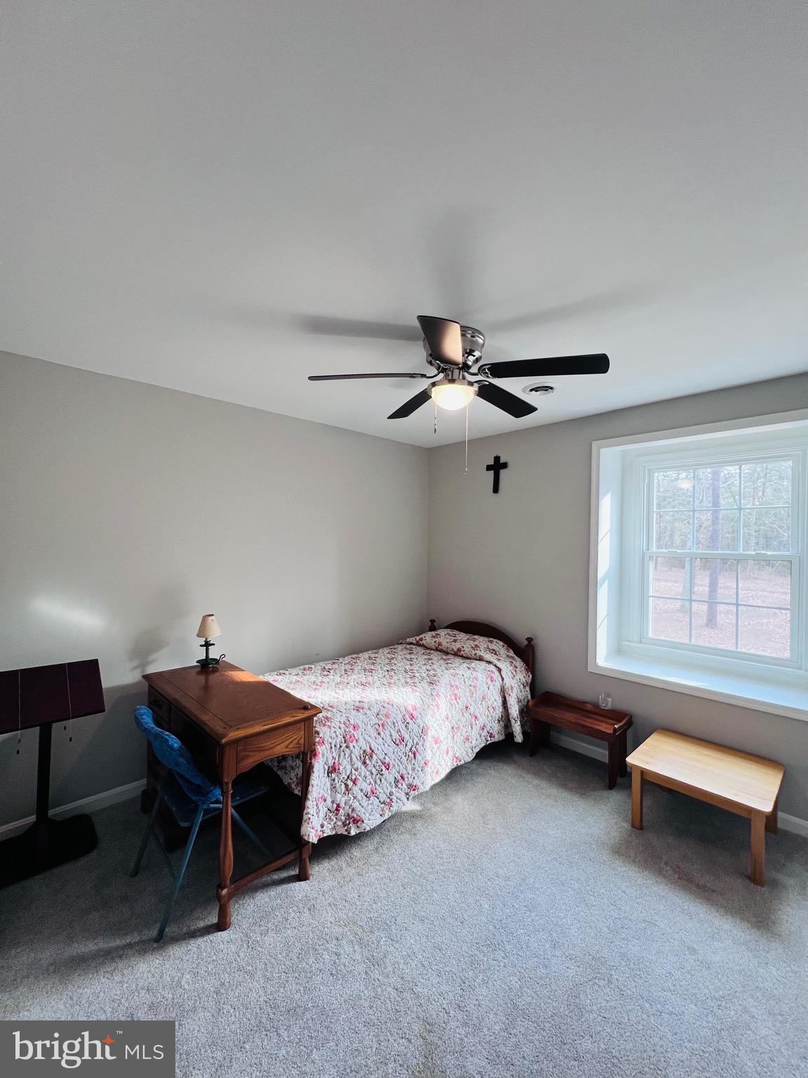 436 Thompson Circle Colonial Beach, VA 22443 - Photo 26 of 40 a bedroom with a bed and a chandelier