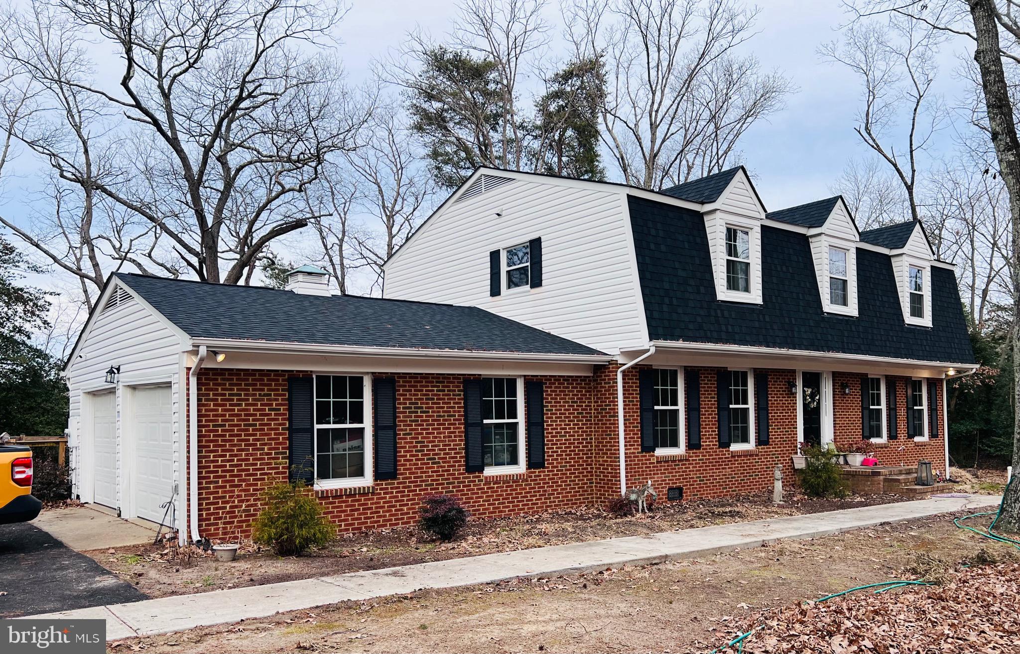 436 Thompson Circle Colonial Beach, VA 22443 - Photo 3 of 40 a front view of a house with a yard