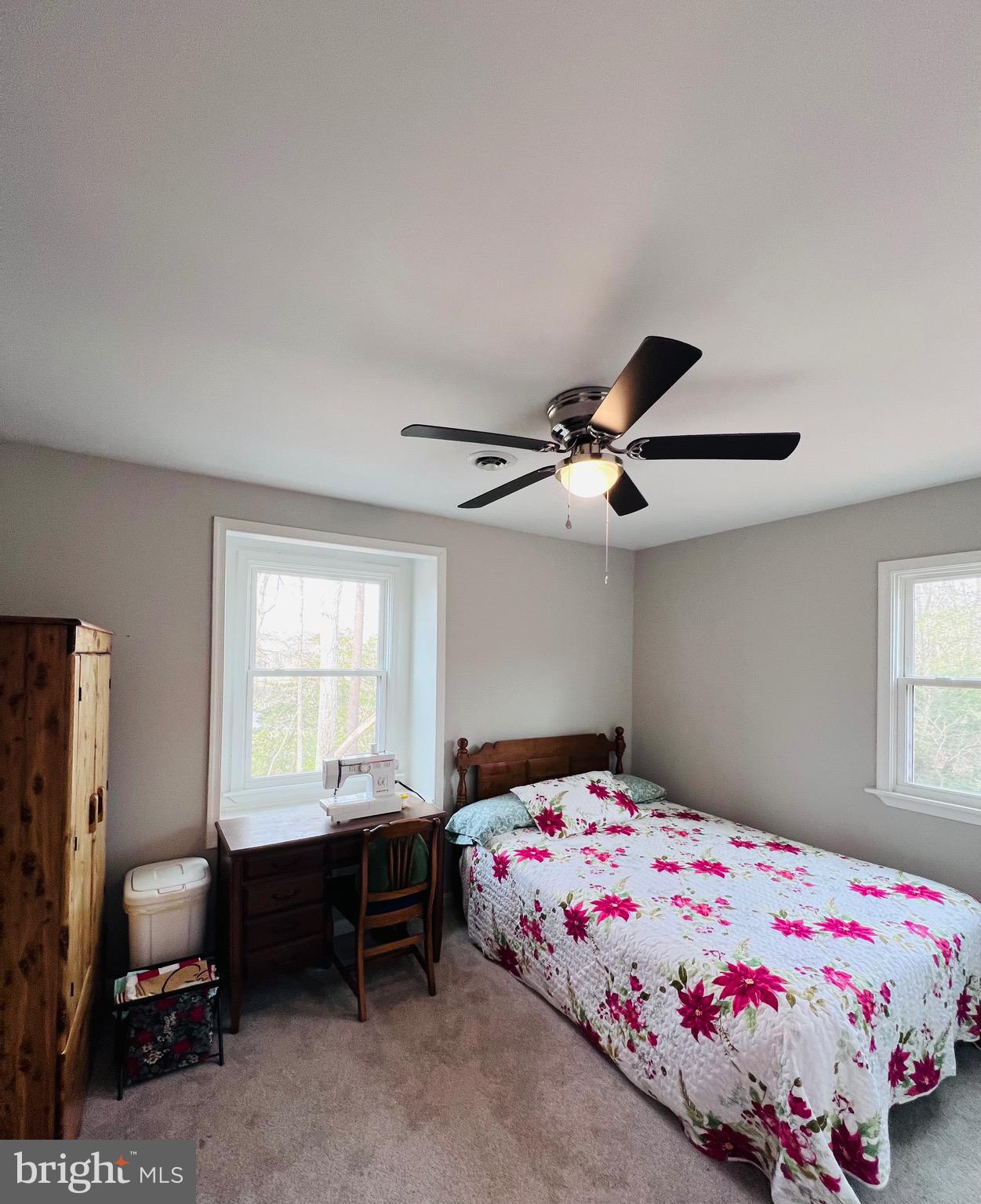 436 Thompson Circle Colonial Beach, VA 22443 - Photo 32 of 40 a bedroom with a bed and a chandelier