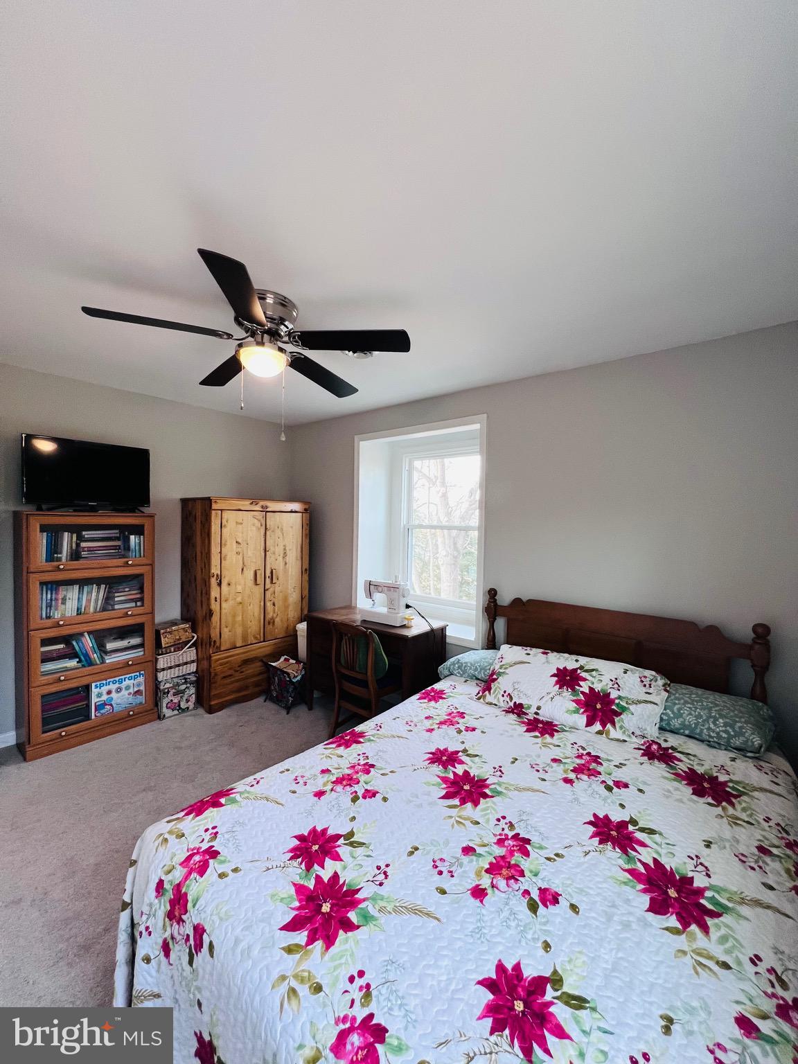 436 Thompson Circle Colonial Beach, VA 22443 - Photo 33 of 40 a bedroom with a bed dresser and a window