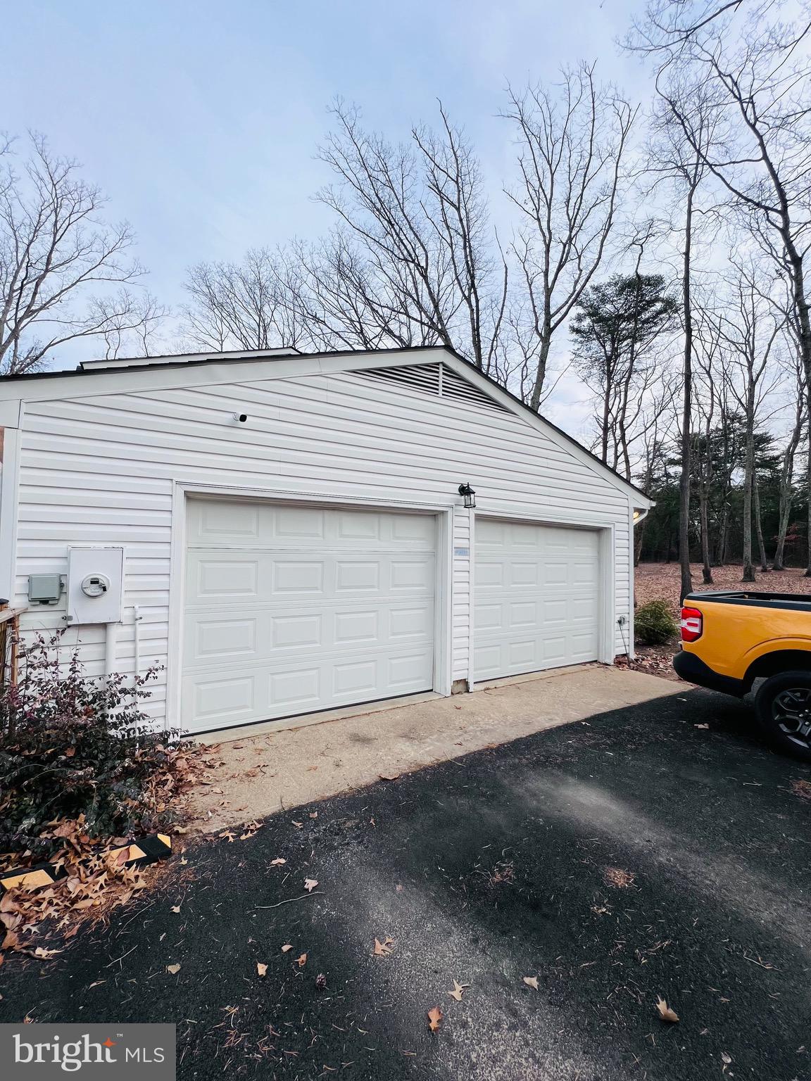 436 Thompson Circle Colonial Beach, VA 22443 - Photo 39 of 40 a view of a house with a yard and garage