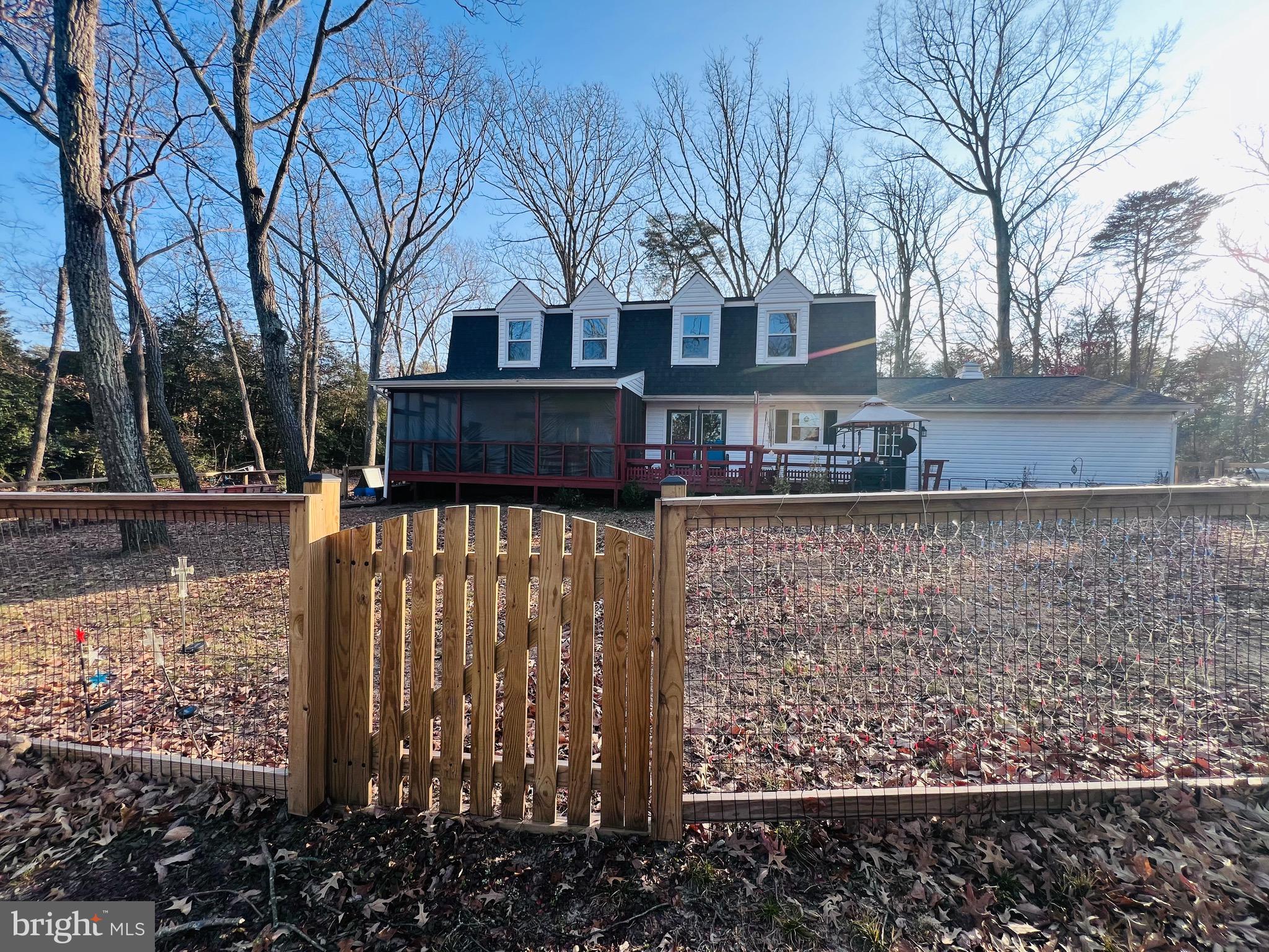 436 Thompson Circle Colonial Beach, VA 22443 - Photo 4 of 40 a view of a yard covered with snow