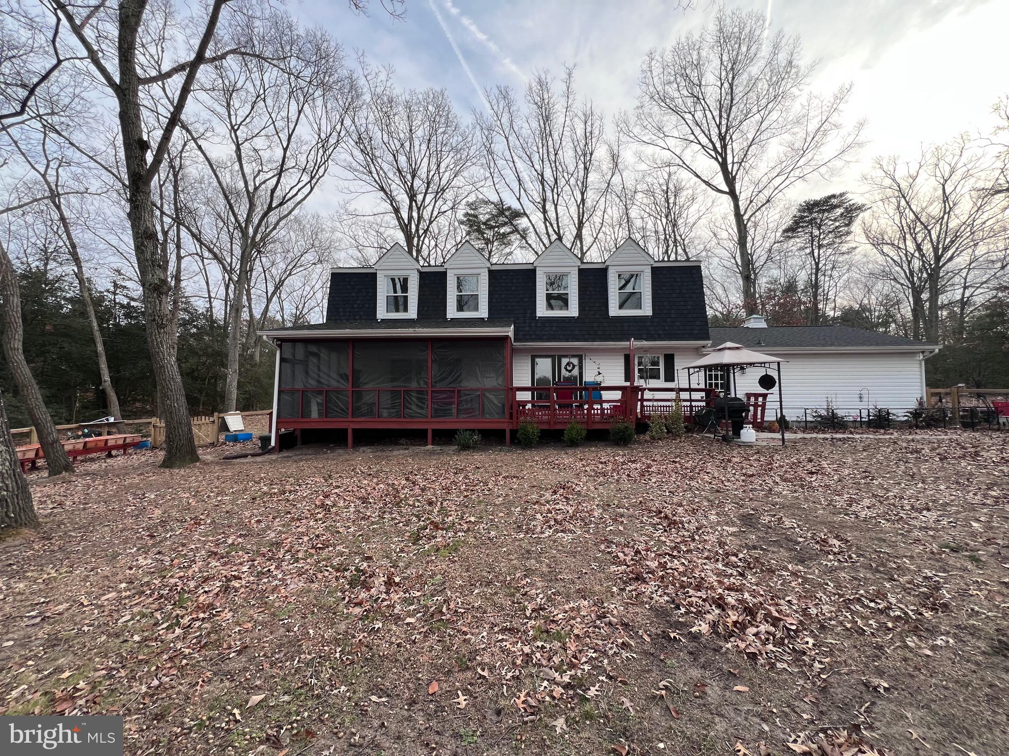 436 Thompson Circle Colonial Beach, VA 22443 - Photo 6 of 40 a view of a house with a yard covered with snow in the yard