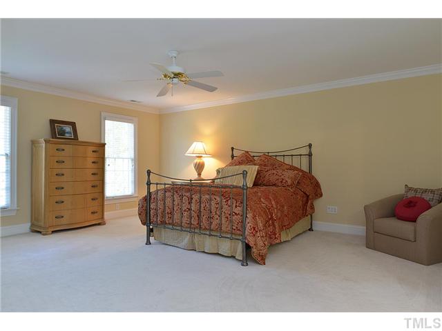 11024 Brass Kettle Road Raleigh, NC 27614 - Photo 12 of 25 a bedroom with a bed and furniture