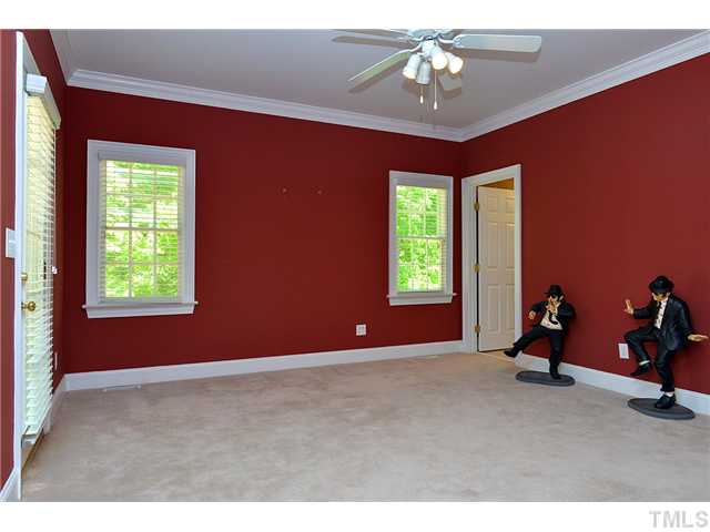 11024 Brass Kettle Road Raleigh, NC 27614 - Photo 15 of 25 a living room with a balcony furniture and a chandelier