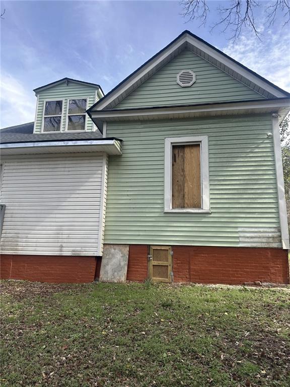 303 Grady Avenue Northeast Rome, GA 30161 - Photo 5 of 17 a front view of a house with garage