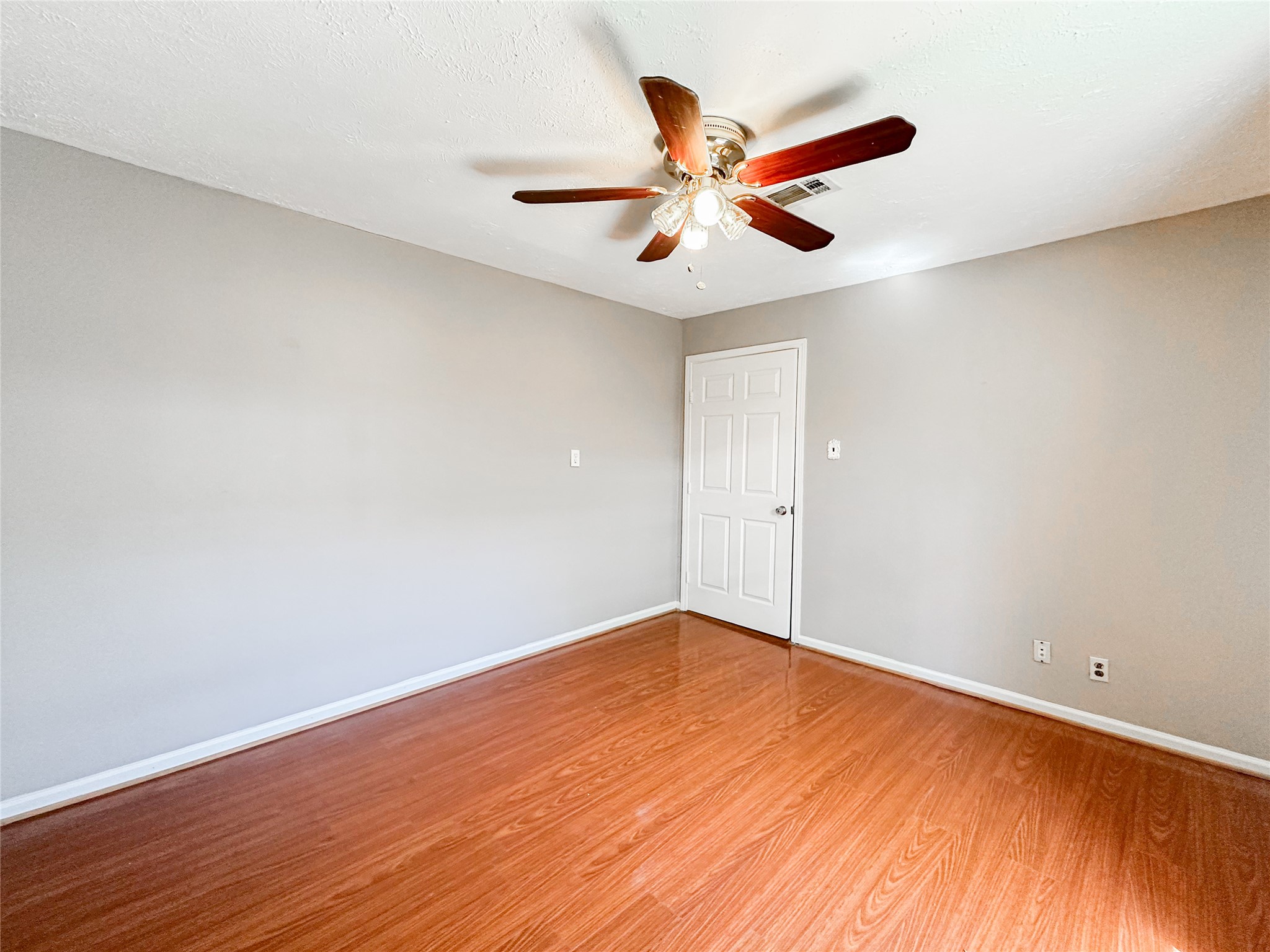 132 Grothe Lane Houston, TX 77022 - Photo 15 of 36 a view of an empty room with wooden floor