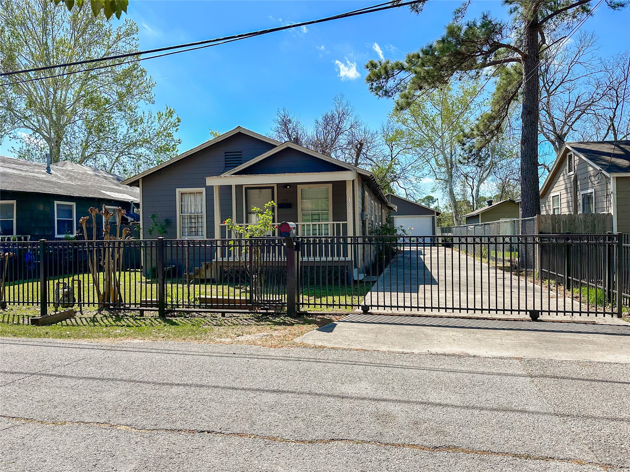 132 Grothe Lane Houston, TX 77022 - Photo 6 of 36 a view of a house with a small yard plants and large trees