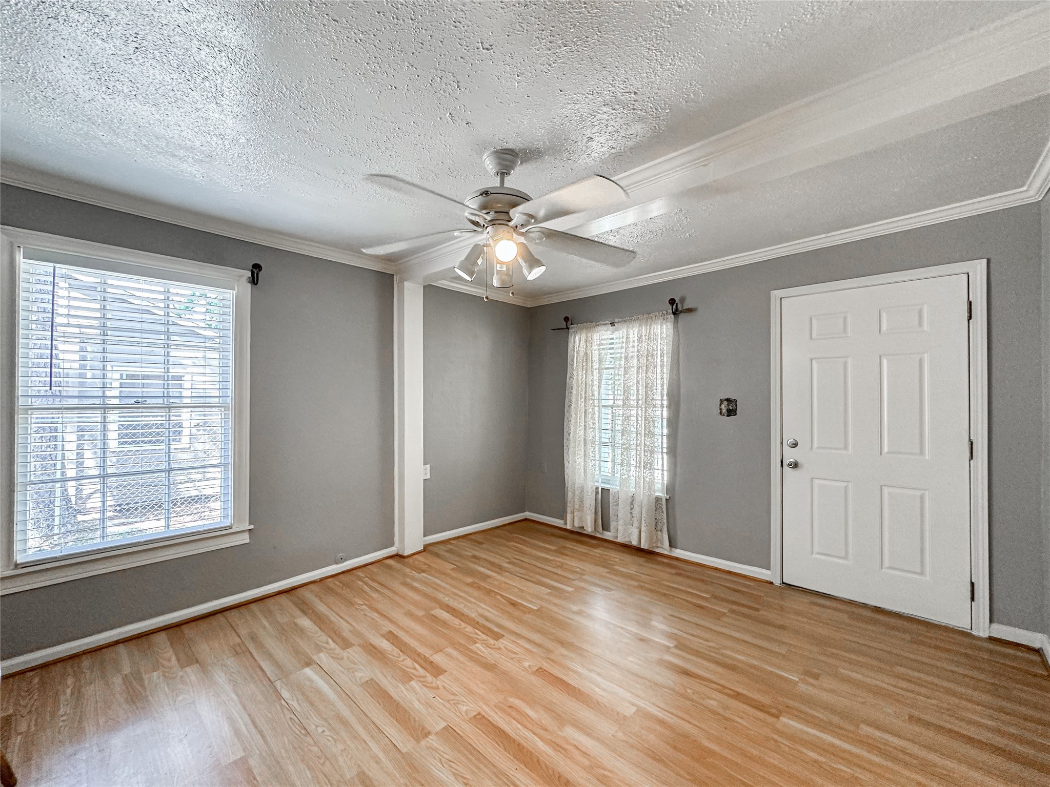 132 Grothe Lane Houston, TX 77022 - Photo 10 of 36 a view of empty room with wooden floor and fan
