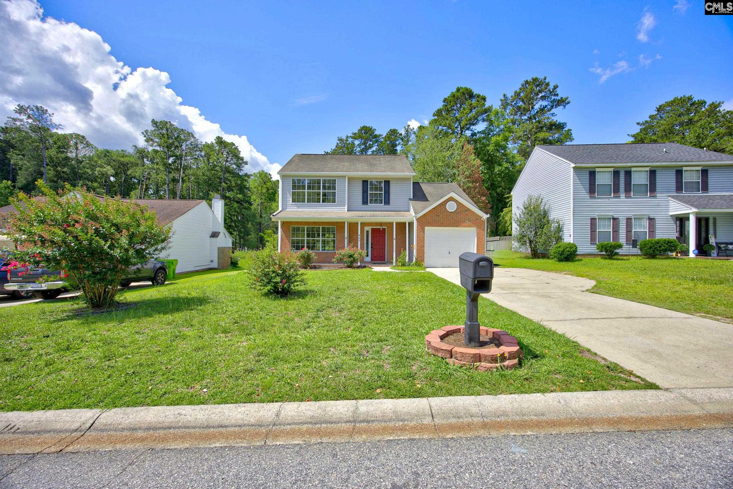 407 Sesqui Trail Columbia, SC 29223 - Photo 5 of 34 a front view of a house with a yard and garage