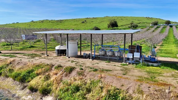 a view of a chairs and table in the patio