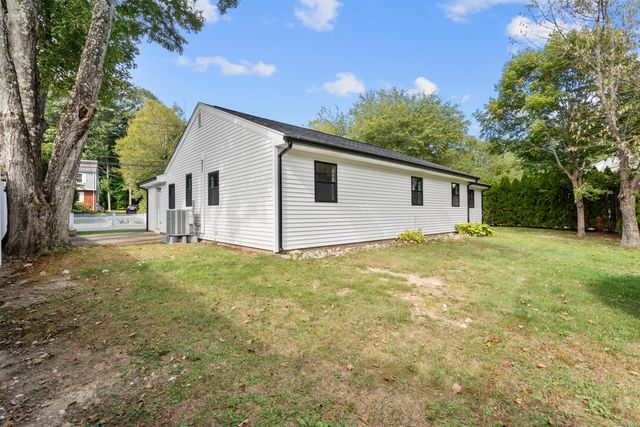 a backyard of a house with lots of green space