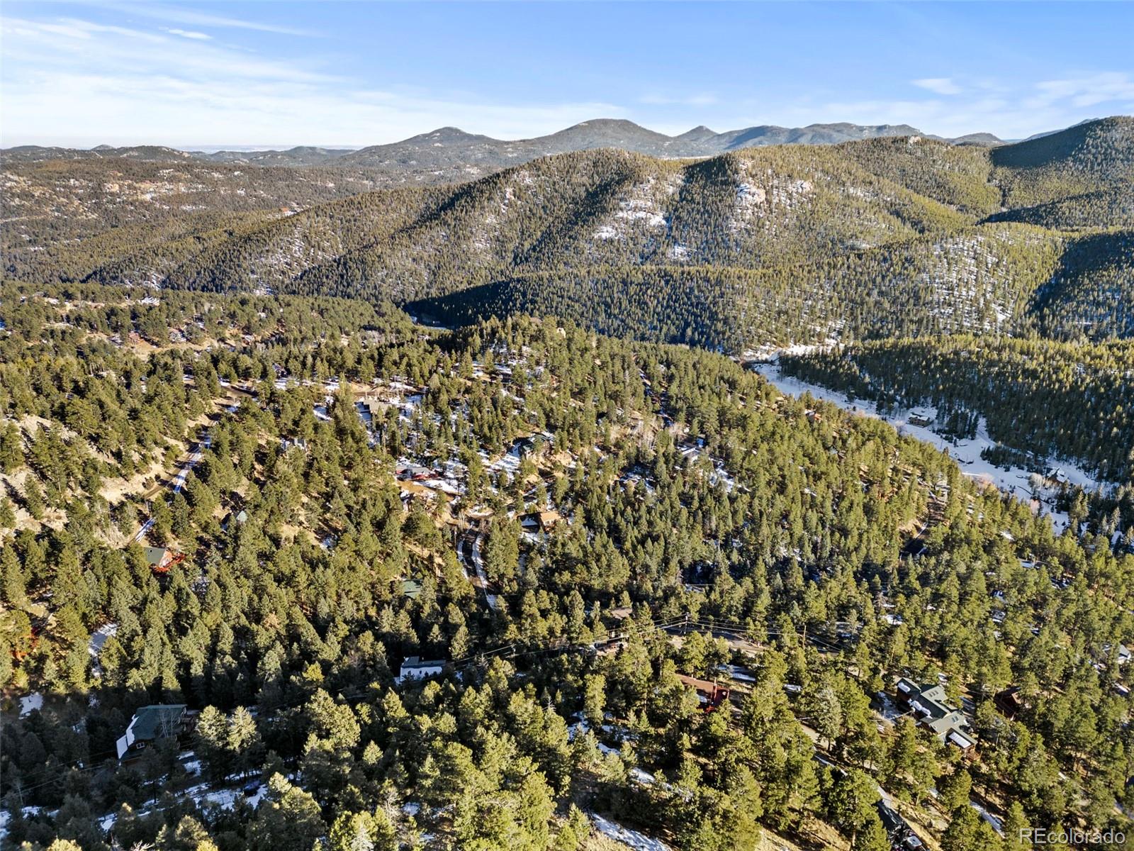 Ridge Road Evergreen, CO 80439 - Photo 11 of 22 a view of a mountain in the distance in a city
