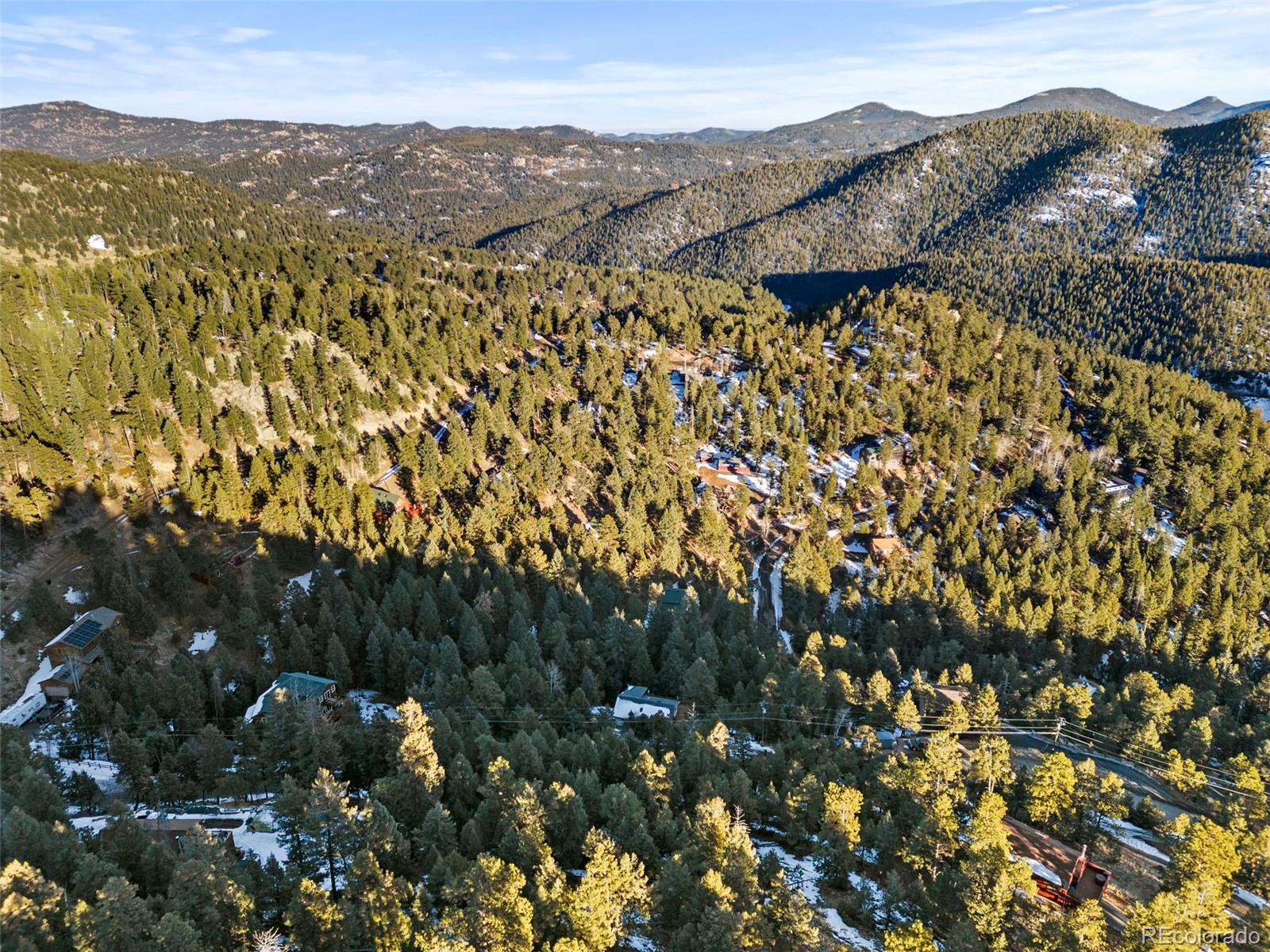 Ridge Road Evergreen, CO 80439 - Photo 10 of 22 a view of a mountain in the distance