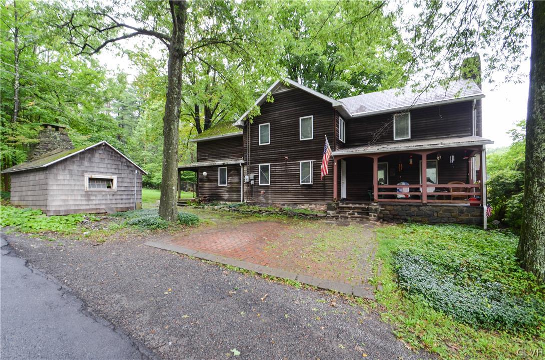 234 Rinker Road Stroudsburg, PA 18360 - Photo 1 of 49 a front view of a house with garden