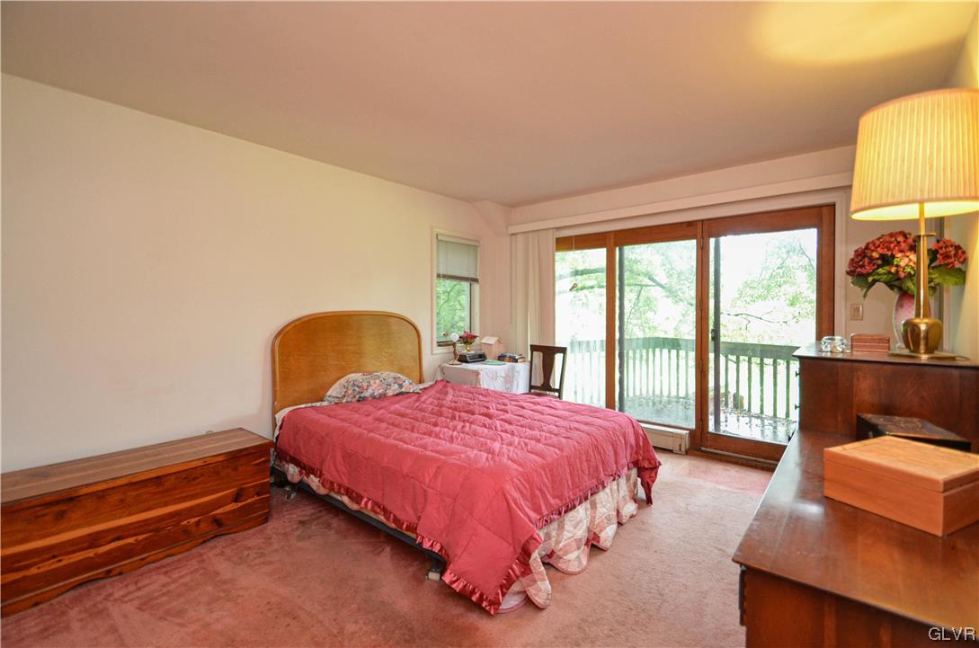 234 Rinker Road Stroudsburg, PA 18360 - Photo 23 of 49 a bedroom with a bed and a potted plant