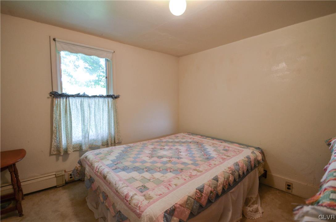 234 Rinker Road Stroudsburg, PA 18360 - Photo 27 of 49 a bedroom with a bed and a window