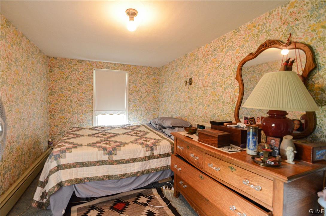 234 Rinker Road Stroudsburg, PA 18360 - Photo 30 of 49 a bedroom with a bed and dresser